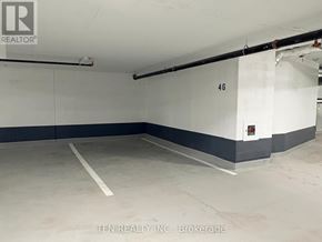 Burlington (Alton) condo for rent - A parking garage with the number 46 on the wall.