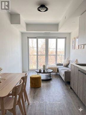 Toronto (Centennial Scarborough) condo for rent - A modern living room with a dining table and a sofa.