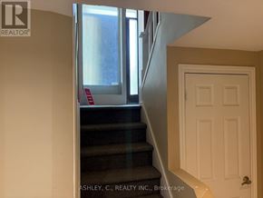 Mississauga (Cooksville) apartment for rent - A staircase with a red sign on the railing.