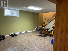 Alfred And Plantagenet apartment for rent - A room with a green wall and a bench press.