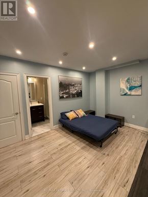 Toronto (Yorkdale-Glen Park) apartment for rent - A bedroom with a bed, dresser, and a painting on the wall.