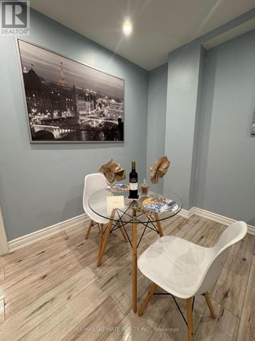 Toronto (Yorkdale-Glen Park) apartment for rent - A dining room with a table set for two and a framed black and white photo on the wall.