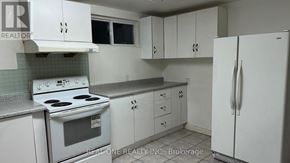 Mississauga (Mississauga Valleys) apartment for rent - A white kitchen with a stove, oven, and refrigerator.