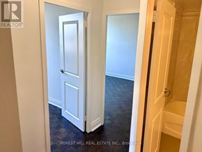 Toronto (Don Valley Village) house for rent - A hallway with a white door and a wooden door.