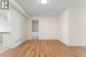Richmond Hill apartment for rent - Empty room with wooden floor and white walls.