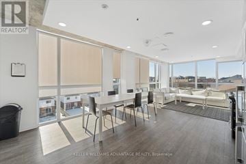 Oshawa (Samac) condo for rent - A spacious living room with a dining table and chairs is shown.