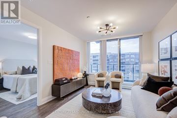 Markham (Unionville) condo for rent - A living room with a large painting on the wall and a view of the city.