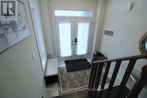 Thorold (Rolling Meadows) apartment for rent - A room with a door, a bench, and a rug.