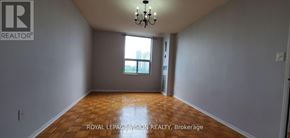 Toronto (Flemingdon Park) condo for rent - A room with wooden floors and a chandelier.