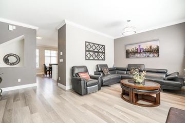 Surrey townhouse for rent - A living room with a grey couch and a coffee table.