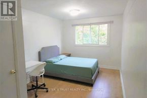 Oakville (Cp College Park) apartment for rent - A bedroom with a bed, desk, and window.