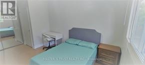 Oakville (Cp College Park) apartment for rent - A bedroom with a bed, nightstand, and a window.