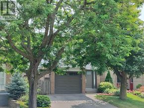 Oakville (Cp College Park) apartment for rent - A house with a tree in front of it.