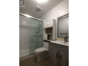 Burnaby apartment for rent - A bathroom with a toilet, sink, and shower.
