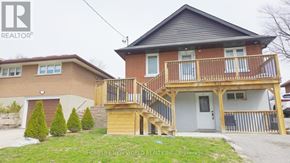 Oshawa (O'neill) apartment for rent - A two-story house with a balcony and a garage.