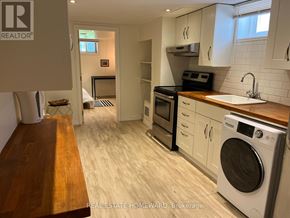 Toronto (Woburn) apartment for rent - A modern kitchen with a washing machine and a dishwasher.