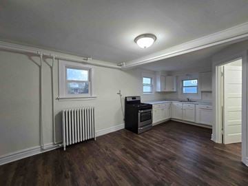 Hammond apartment for rent - A kitchen with a black stove top oven and white cabinets.