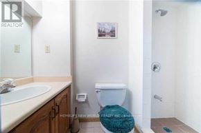 Toronto (Steeles) apartment for rent - A bathroom with a toilet, sink, and shower.