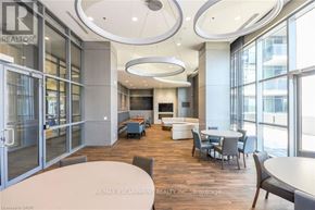 Burlington (Freeman) condo for rent - A conference room with a glass door and a table with chairs.