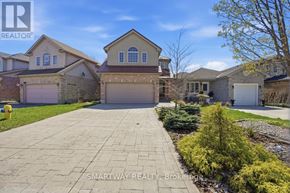 London East (East A) apartment for rent - A real estate photo of a house with a driveway and garage.