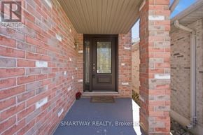 London East (East A) apartment for rent - A brick wall with a door and a sign that says Smartway Realty, Brokerage.