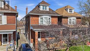 Hamilton (Crown Point) apartment for rent - A large red brick house with a car parked in front.