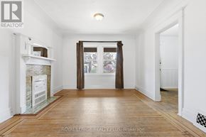 Hamilton (Crown Point) apartment for rent - A white room with a fireplace and a wooden floor.