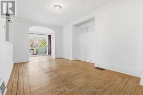 Hamilton (Crown Point) apartment for rent - A room with wooden flooring and white walls, with a window and a door visible.