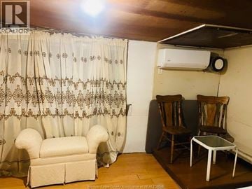 Leamington apartment for rent - A living room with a sofa, chairs, and a curtain.