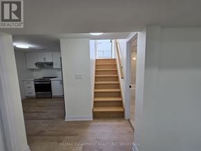 St. Catharines (Secord Woods) apartment for rent - A hallway with a staircase leading to the second floor.