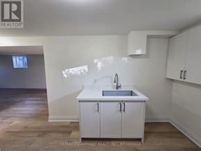 St. Catharines (Secord Woods) apartment for rent - A kitchen with white cabinets and a sink.