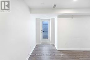 Oshawa (Taunton) apartment for rent - A room with a door and a window.