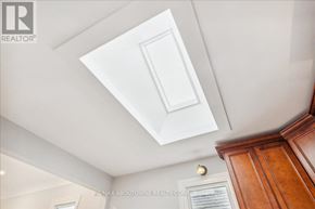 Hamilton (Raleigh) apartment for rent - A white ceiling with a light fixture and a wooden cabinet.
