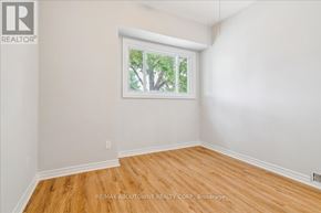 Hamilton (Raleigh) apartment for rent - A room with a window showing trees outside.
