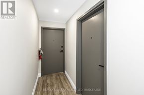 Port Colborne (Sugarloaf) apartment for rent - A hallway with two doors and a fire extinguisher on the wall.