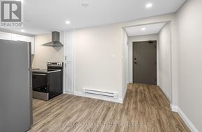 Port Colborne (Sugarloaf) apartment for rent - A kitchen with a refrigerator, stove, and oven.