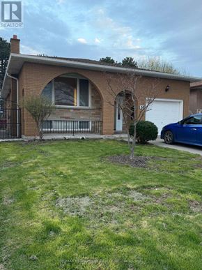 Hamilton (Kentley) apartment for rent - A house with a blue car parked in front.