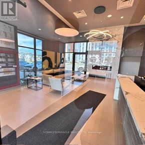 Milton (Walker) condo for rent - A realtor's office with a large window and a view of the city.