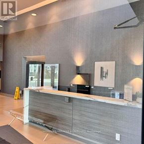 Milton (Walker) condo for rent - A realtor's office with a reception desk and a large window.