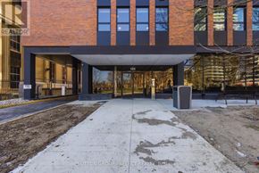 London East (East F) condo for rent - A modern building with a brick facade and a large glass entrance.