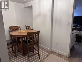 West Vancouver apartment for rent - A dining room with a wooden table and chairs.