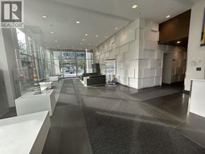 Burnaby apartment for rent - A hallway with a person sitting on a bench.