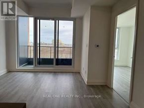 Markham (Unionville) condo for rent - A room with a sliding glass door leading to a balcony.