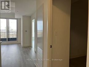 Markham (Unionville) condo for rent - A room with a sliding glass door and a wall with a window.