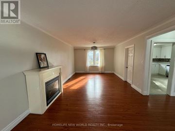 Richmond Hill (Crosby) apartment for rent - A living room with a fireplace and wood floors.