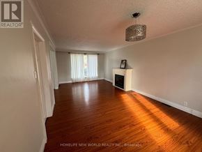 Richmond Hill (Crosby) apartment for rent - A room with wooden floors and a chandelier hanging from the ceiling.