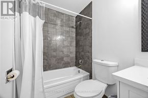 Toronto (Morningside) townhouse for rent - A white bathroom with a toilet, sink, and bathtub.