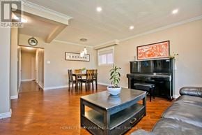 Toronto (Bendale) apartment for rent - A living room with a leather couch, a coffee table, and a television.