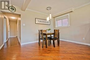 Toronto (Bendale) apartment for rent - A dining room with a wooden table and chairs.
