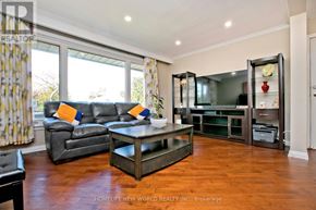 Toronto (Bendale) apartment for rent - A living room with a grey couch and a coffee table.